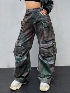 High-waisted oversized cargo pants with vintage washed texture and multiple utility pockets