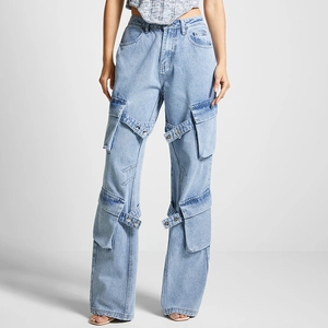 Detail of light blue denim cargo pants with multi-pockets and decorative lacing straps