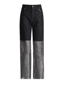 Detail of high waist black denim jeans with sparkling rhinestone mesh hollow stitching