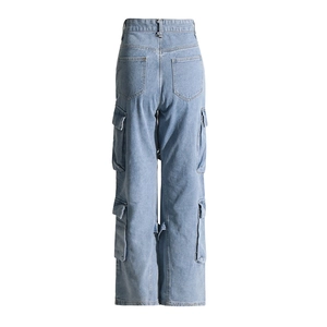 Detail view of high waist light blue denim cargo pants with large flap back pockets