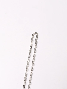 Macro detail of silver long oval link metal chain with high polish glossy finish