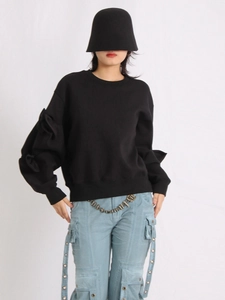Fashionable black crewneck sweatshirt with bow knot sleeve design and metal chain details