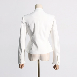 Detailed back view of a white tailored blazer featuring slim fit fishbone waist stitching