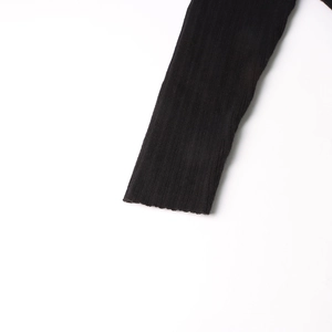 Detailed macro view of the elastic ribbed knit cuffs on a casual black sweater