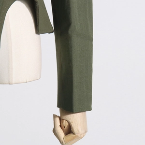 Close-up of army green long sleeve cuff showing twill fabric texture and stitching