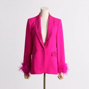 Macro detail of rhinestone lapel and ostrich feather cuffs on magenta tailored blazer