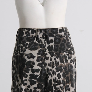Detail view of high-waisted leopard print cargo pants with rear welt pockets and belt loops