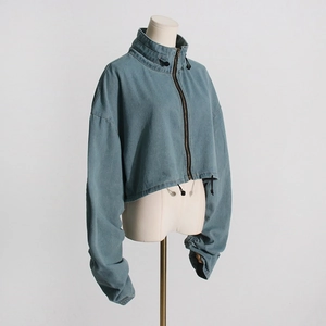 Detail view of dark blue cropped denim utility jacket with adjustable drawstring high neck collar