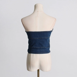 Detail view showing back stitching and side zipper of dark blue denim tube top