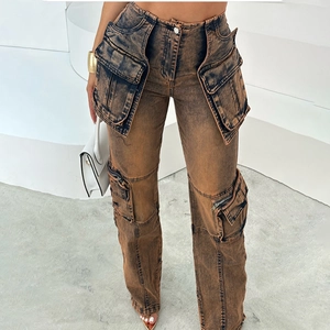 Detail of high-waisted vintage acid wash cargo jeans with large utility flap pockets