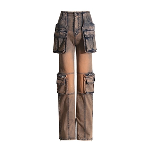 Detailed view of cargo denim pants with 3D utility pockets and a vintage wash finish
