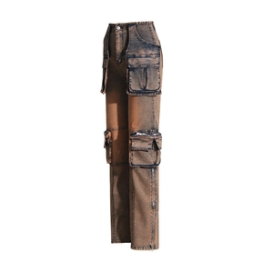 Detail of vintage washed cargo jeans featuring multiple side pockets and metallic zippers