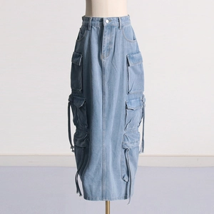 Close-up of utility cargo denim skirt with symmetrical large pockets and drawstring details