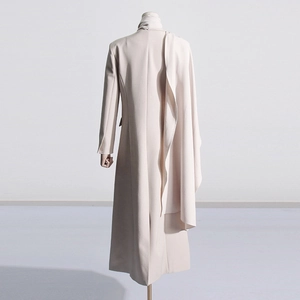 Detailed back view of minimalist cream long trench coat with elegant draped pleated design