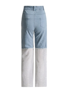 High-waist light blue denim pants featuring sparkling rhinestone mesh patchwork design