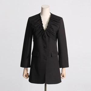 Detail of elegant black V-neck blazer featuring layered ruffles and slim-fit waist design