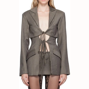 Detailed view of grey lace-up blazer and mini skirt set with unique cut-out design