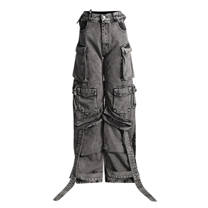 Detail of high waist grey cargo jeans featuring multi-pockets and decorative long straps