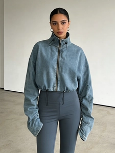 Women's vintage washed blue cropped denim jacket with ruched adjustable drawstring sleeves