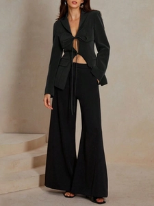 Fashionable black V-neck cutout blazer with bow tie and matching wide-leg trousers set