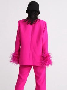 Magenta suit set with feather cuffs and tailored blazer shown from back view
