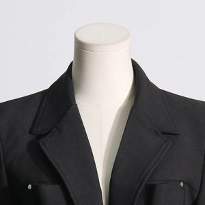 Detail of the V-neck lapel and silver buttons on this elegant black blazer for women