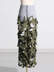 Army green camo patchwork maxi skirt with irregular laser cutouts and high waist zipper