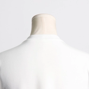 Detail shot of the ribbed neckline and premium cotton fabric on white split T-shirt