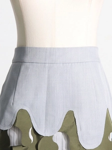 Army green asymmetric layered camouflage skirt with irregular cut and cutout details