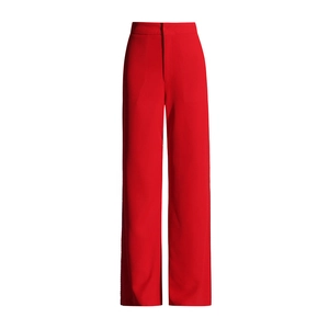 Detailed view of high-waisted red wide-leg trousers showing heavy drape fabric and fit