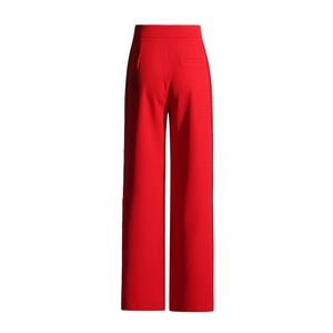 Detail view of the high waist red wide-leg trousers featuring a back pocket and side stitching