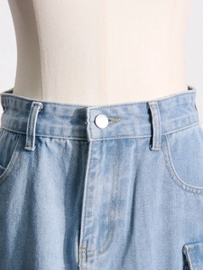 High waist washed light blue denim skirt with cargo pockets and yellow contrast stitching