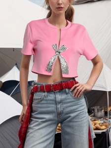 Pink cropped short sleeve T-shirt with a large rhinestone bow and sparkling sequins