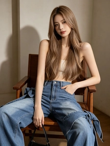 Jean large dégradé bleu à taille haute avec détails de nœuds et coupe évasée
