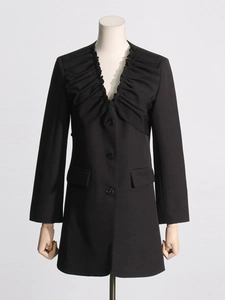 Elegant black long-sleeved blazer featuring a deep V-neck and decorative ruffled collar detail