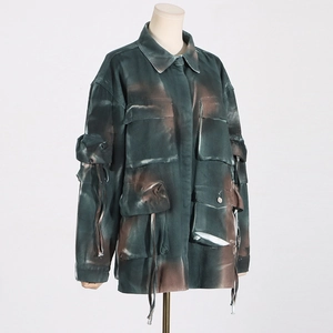 Close-up of utility jacket featuring mixed-color tie-dye print and large flap pockets