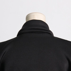 Detail of elegant V-neck lapel and premium satin texture on this black blazer dress