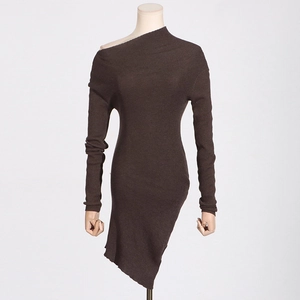 Detail of dark brown ribbed knit fabric and asymmetrical off-shoulder neckline on dress