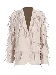 Fashionable beige V-neck blazer for women with decorative satin bows and flap pockets