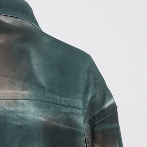 Detail of gradient wash denim jacket with double-needle stitching and twill texture