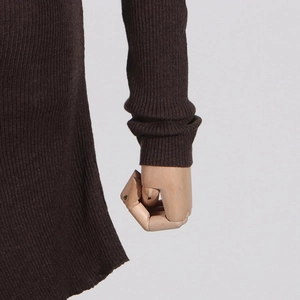 Detailed view of dark brown ribbed knit fabric with elegant sleeve draping texture