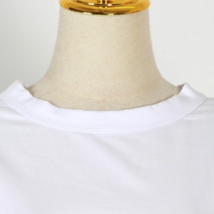 Close-up of white T-shirt neckline with ribbed trim and double-needle stitching details