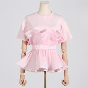Detail of pink t-shirt featuring pleated ruffle hem and 3D layered structure design