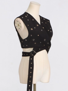 Women's punk style black sleeveless vest with silver eyelets and adjustable buckle belt