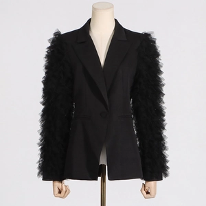 Detail of elegant black blazer featuring ruffled mesh sleeves and a slim-fit tailored design