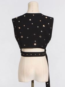 Black sleeveless vest with metallic grommets and matching eyelet belt in punk style