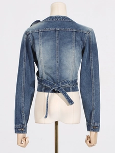Short blue washed denim jacket for women featuring asymmetric cross tied waist detail