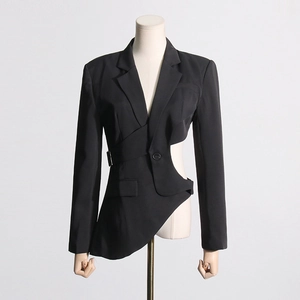 Detail of black asymmetric blazer with side cutout design and metal ring buckle tie