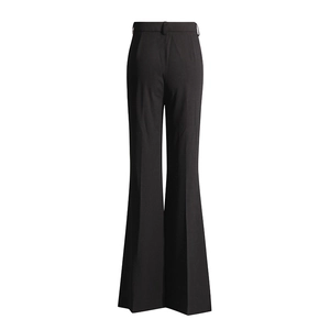 Close-up of black high-waisted wide-leg trousers with elegant pressed creases and belt loops