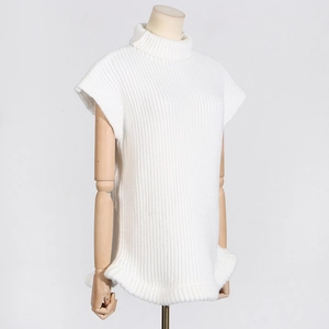 Detail of white high-neck sleeveless knit vest featuring ribbed texture and wavy hem design